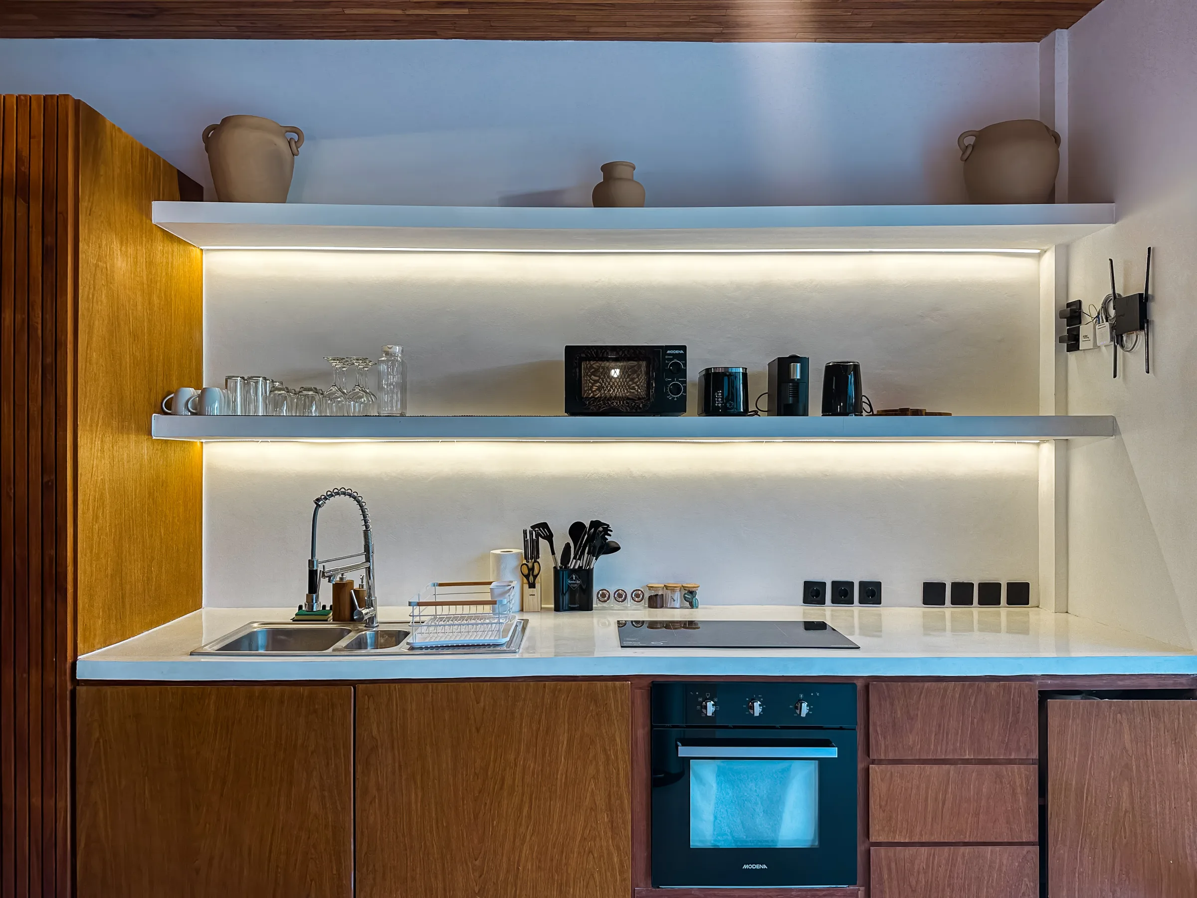 Casa Petak kitchen island and dining with timber and stone finishes