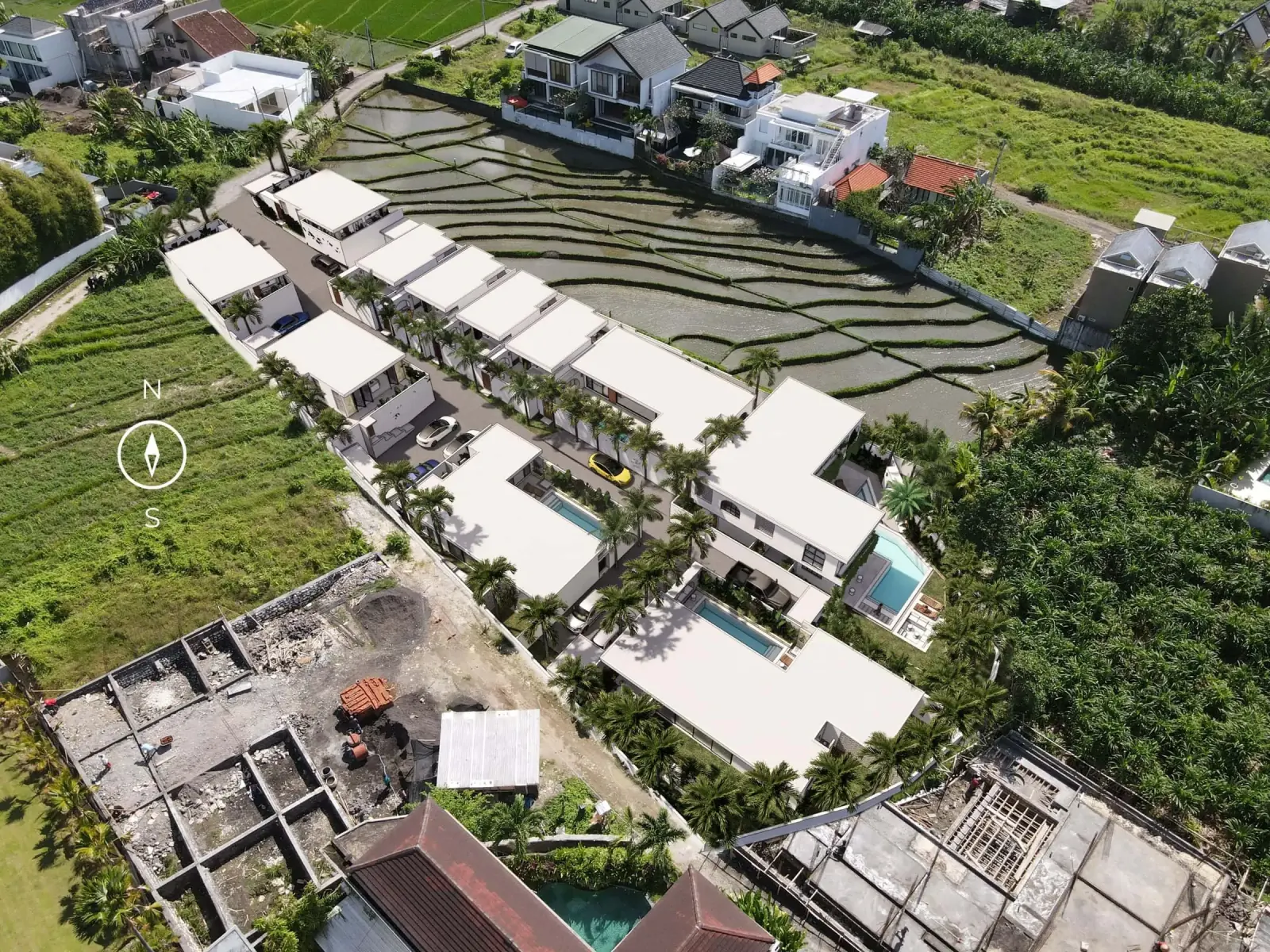 Casa Petak Canggu - aerial view of the completed development surrounded by rice fields