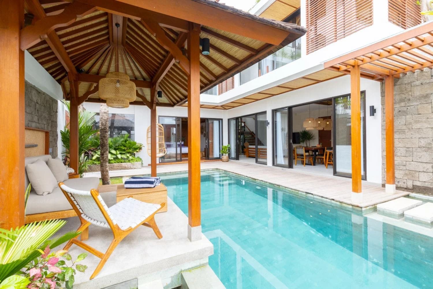 Aura Alami villa exterior - pool, alang-alang gazebo and open-plan living, Balitecture build in Bali